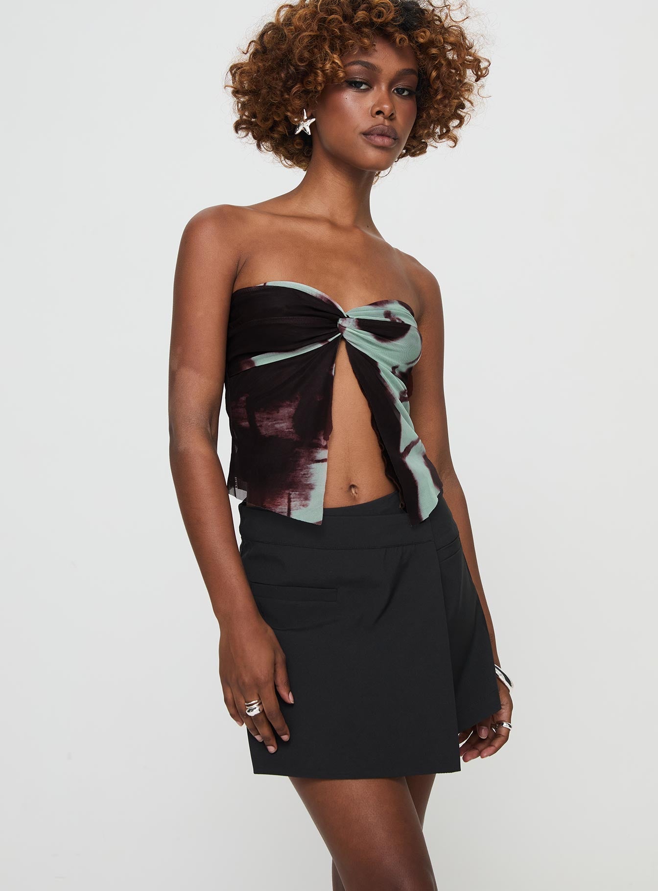 side view of model wearing Princess Polly Castio Skort Black High Waisted Shorts 