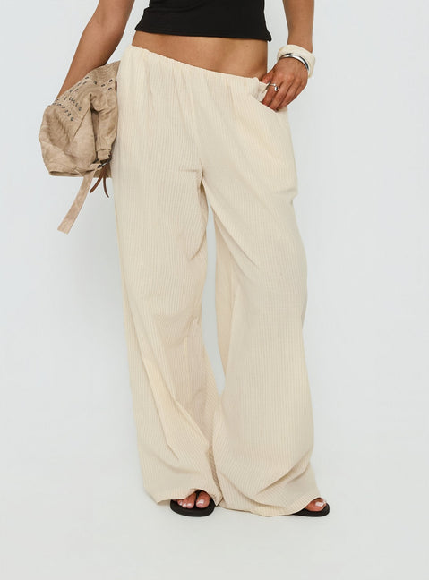 side view of model wearing Princess Polly Lunea Concealed Waistband Pants Beige Stripe Low Rise Pants Pants 