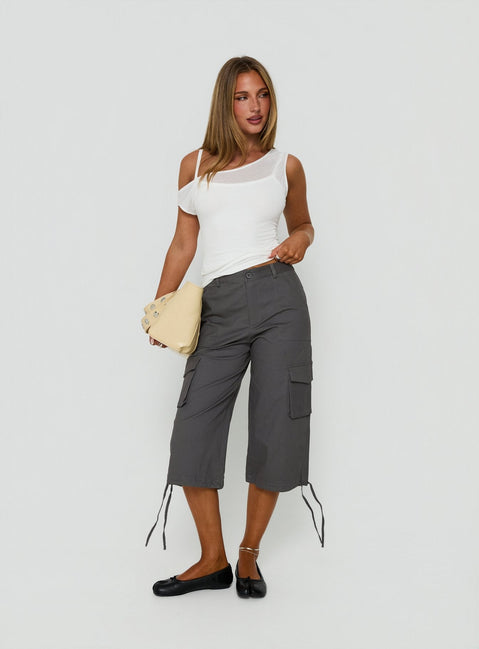 Showcasing the Alfonza Utility Capri in Slate womens-regular-pants with mid-rise cargo design side view of model wearing Princess Polly