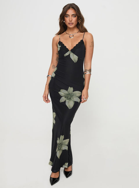 side view of model wearing Princess Polly Stardrop Maxi Dress Black Floral V-Neck 