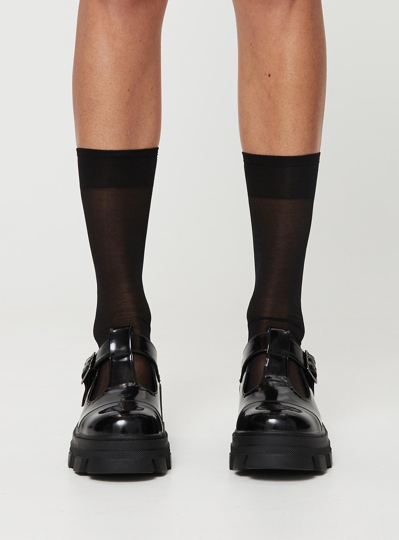 Loafer heels, faux patent leather material Buckle fastening, platform base, rounded toe, treaded sole