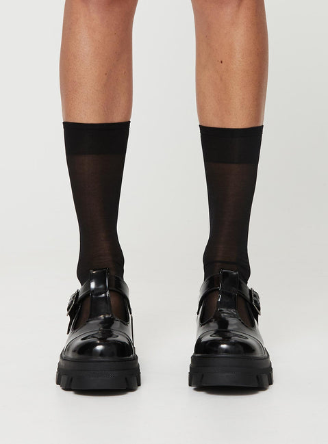 Loafer heels, faux patent leather material Buckle fastening, platform base, rounded toe, treaded sole