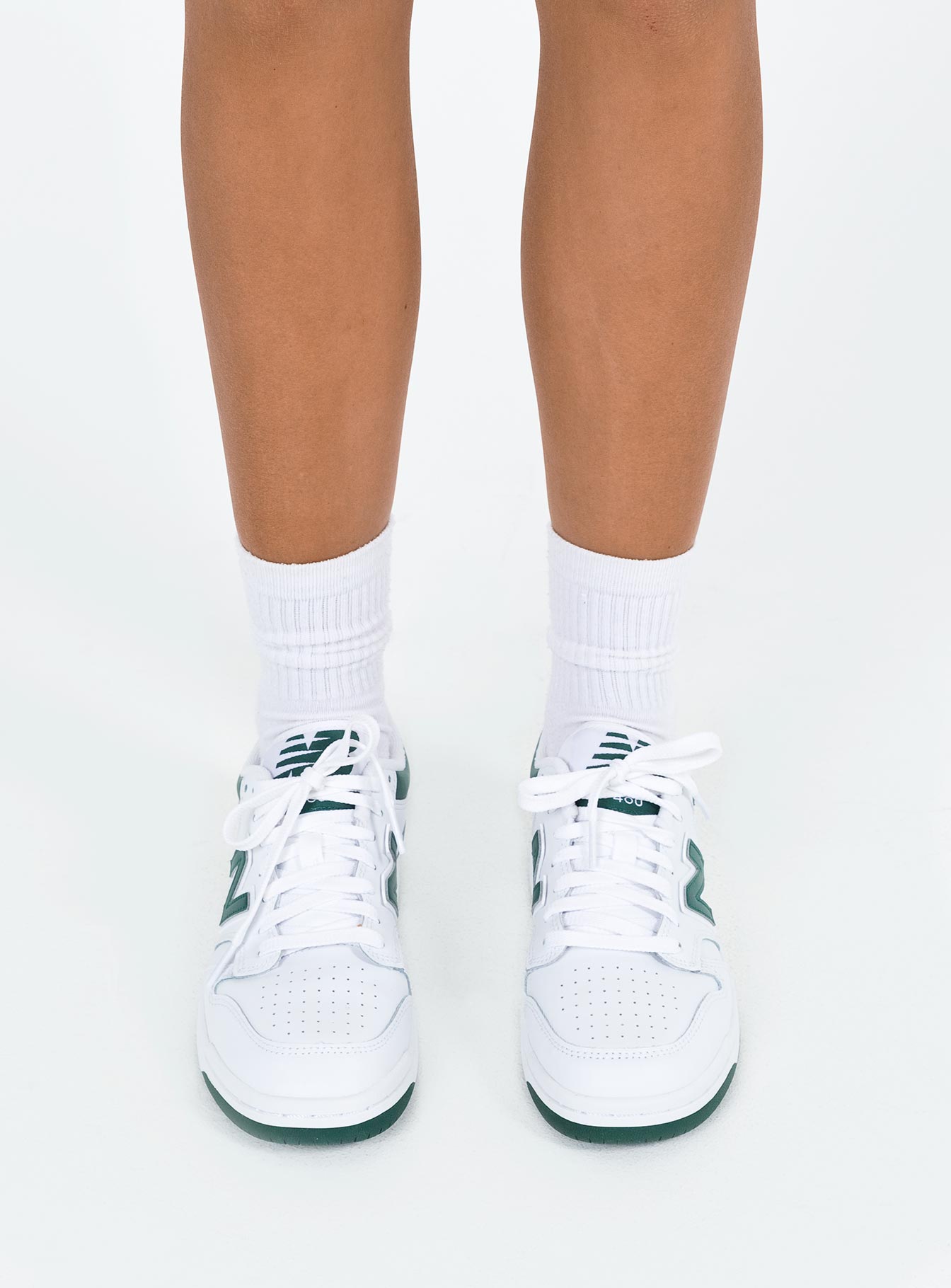 Sneakers Faux leather material Lace up fastening Padded footbed Rounded toe Treaded sole