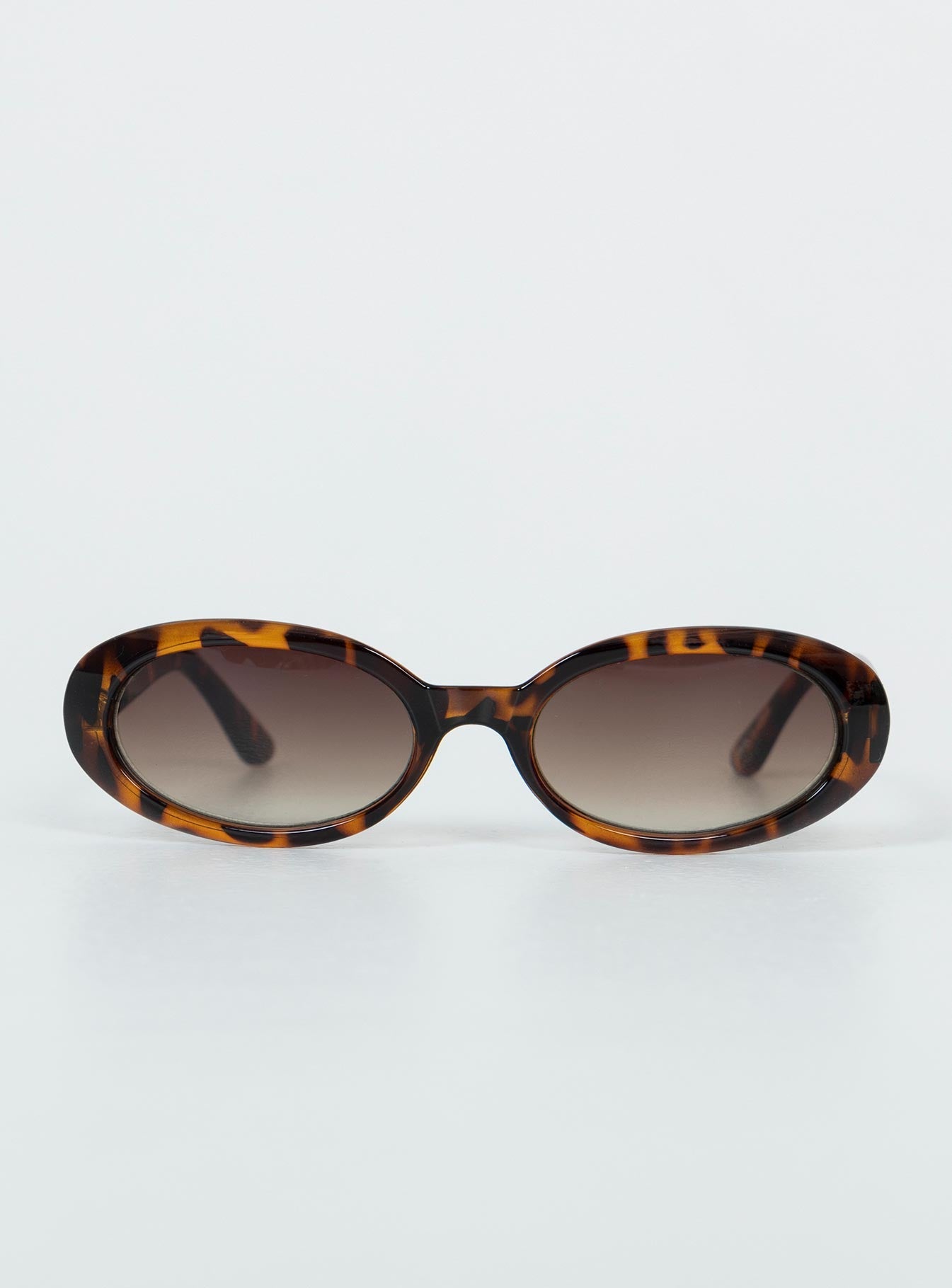 Rounded frame Tort frame Moulded nose bridge Brown tinted lenses
