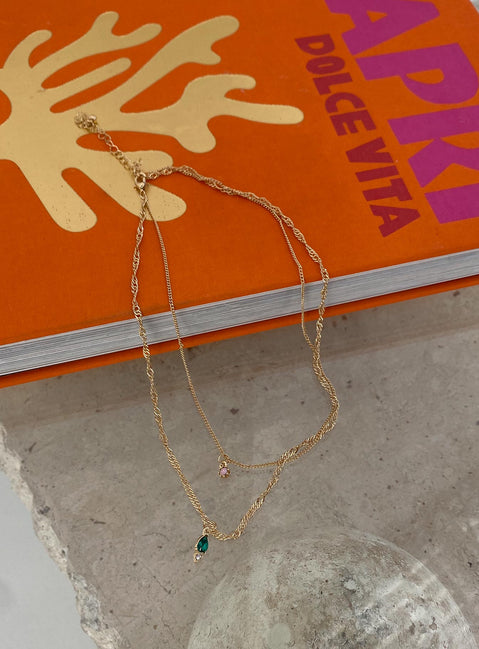 Necklace pack 90% recycled steel 5% recycled zinc 5% glass Pack of two  Fixed design - these can not be worn separately  Dainty gold chains  Small pendants  Lobster clasp fastening 