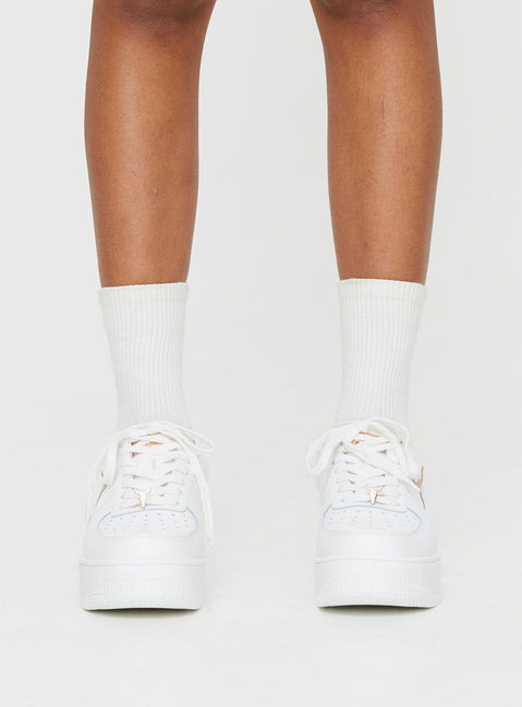 Faux leather sneakers Rounded toe, lace fastening, gold-toned hardware, platform base, passed footbed, treaded sole