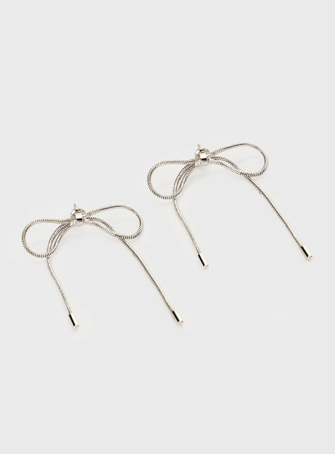 Silver-toned earrings Bow design, stud fastening