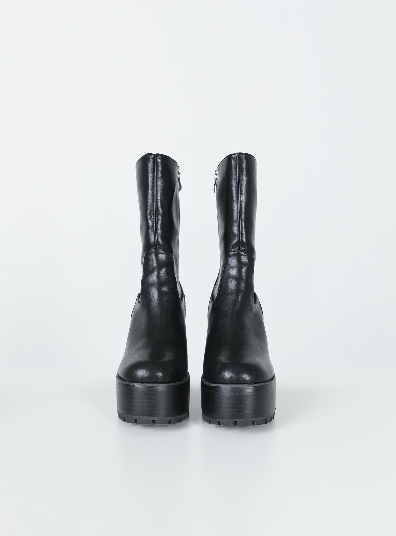 Boots Faux leather material  Mid-calf length  Zip fastening at side  Rounded toe Platform base  Block heel  Treaded sole