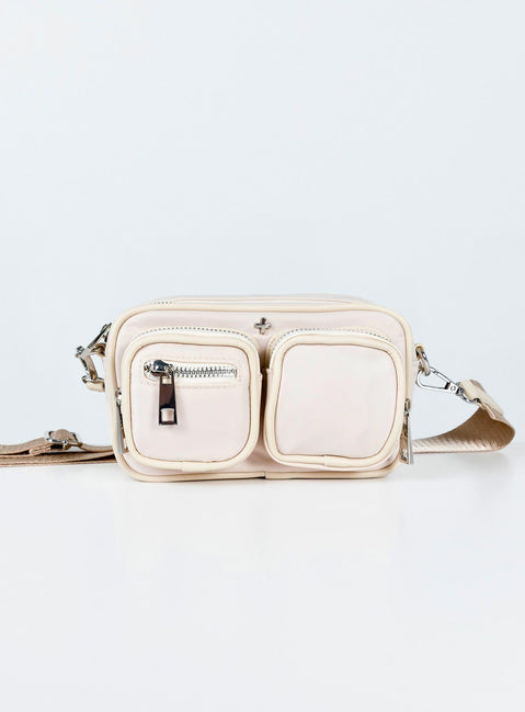Crossbody bag Nylon material  Silver-toned hardware  Three external pockets  Zip fastenings  Internal pockets  Removable & adjustable strap  Flat base