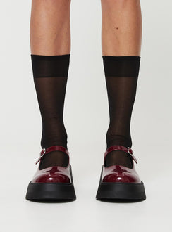 Faux patent leather loafer Platform base, treaded sole, single strap upper, silver-toned hardware, buckle fastening