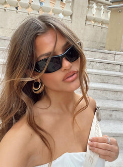 Sunglasses Wrap around design Light weight frame Black tinted lenses Moulded nose bridge