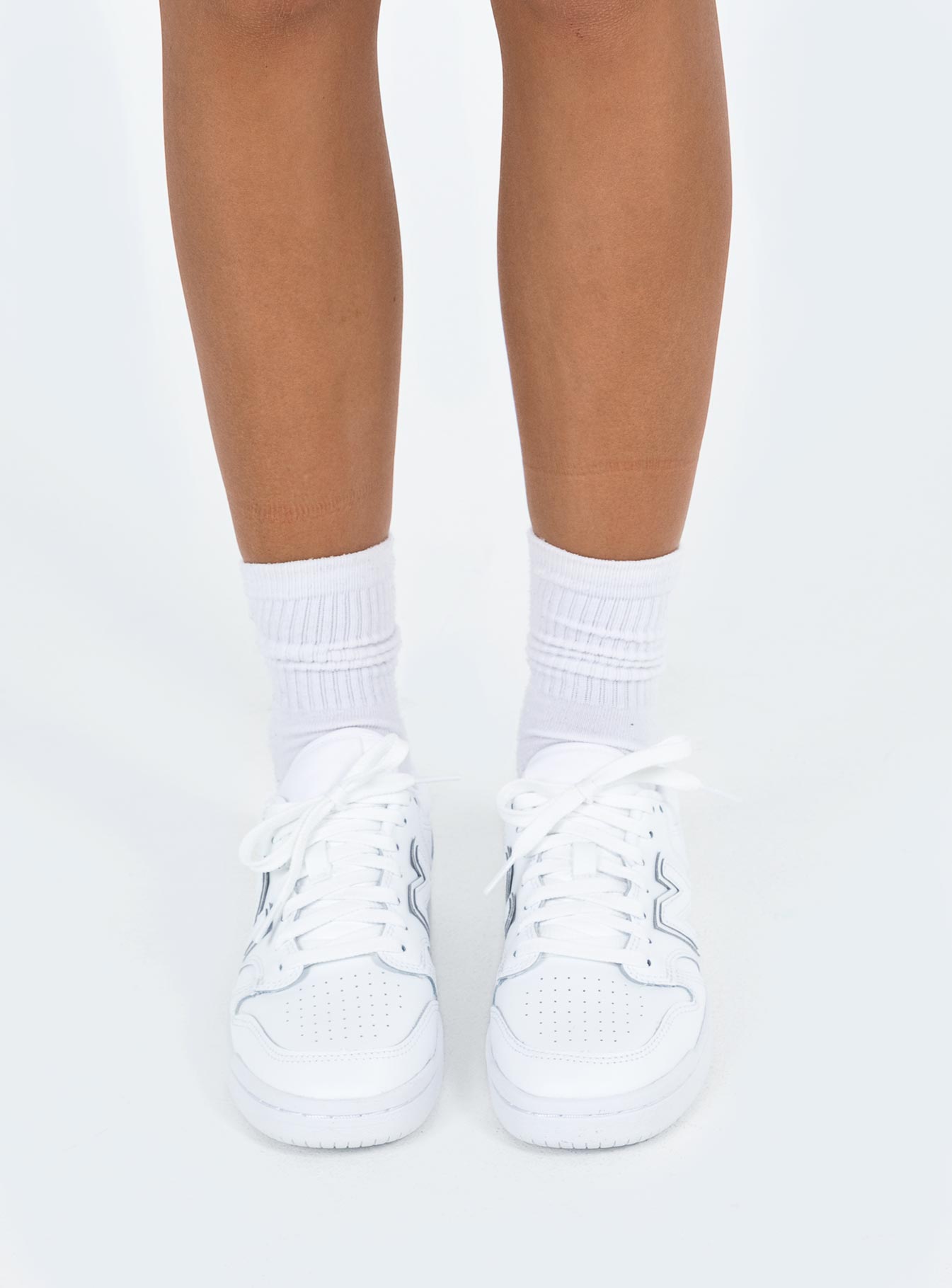 Sneakers Faux leather material Lace up fastening Padded footbed Rounded toe Treaded sole