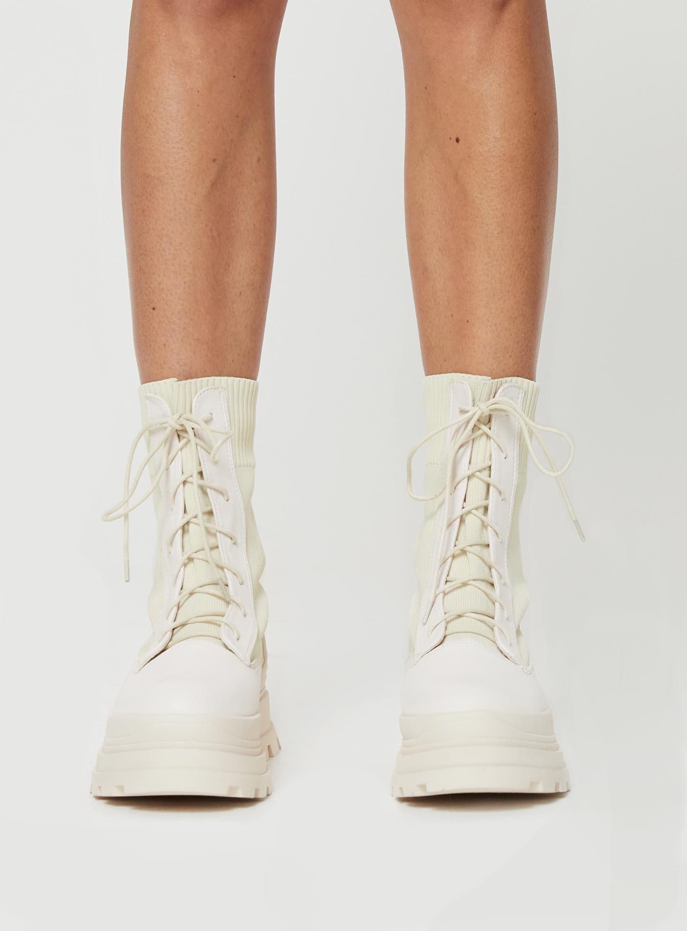 Knit & PU boots Platform base, lace fastening, rounded toe, padded footbed, treaded sole