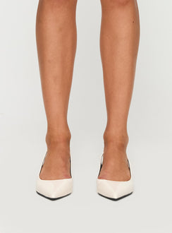 Kitten heel Patent material look, pointed toe, sling back style, pin buckle fastening