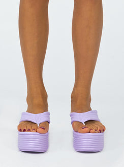 Sandals 100% polyurethane Faux leather material Flip-flop style upper  Exaggerated platform base  Rounded toe  Padded footbed  Heel height: 7cm / 2.7" 