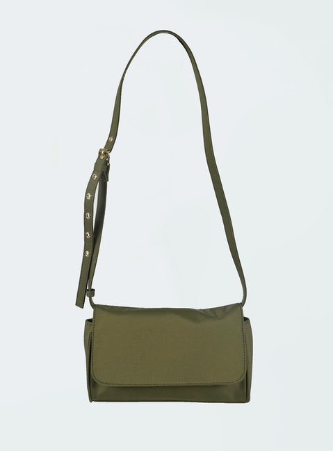 Crossbody bag Adjustable crossbody strap Gold-toned hardware Magnetic button fastening Internal zip pocket & card slip  Flat base