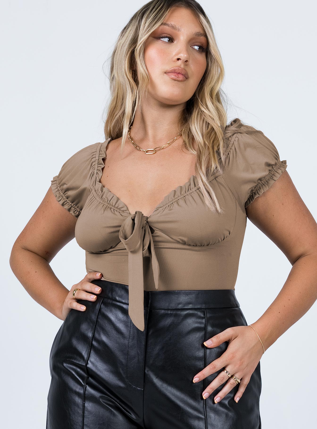 front view of model wearing Princess Polly Medina Bodysuit Brown Short Sleeves Plunger 