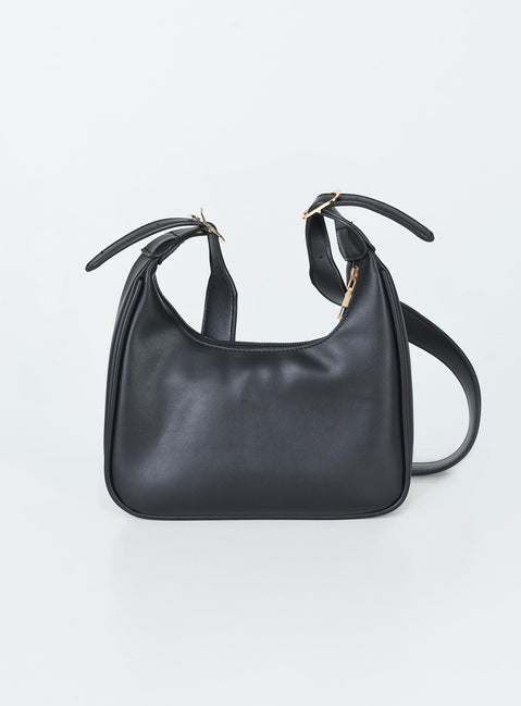 Shoulder bag  Faux leather material  Adjustable shoulder strap  Gold-toned hardware   Zip fastening  Single internal zip pocket  Flat base 