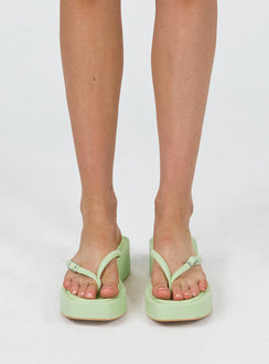 Sandals Flip-flop style upper Silver-toned buckle detail Platform base Square toe  Padded footbed 