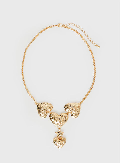 Gold-toned necklace Chunky design, heart pendants, lobster clasp fastening
