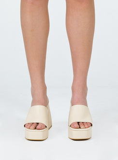 Cream mules Faux leather material Single wide upper Block heel Platform base