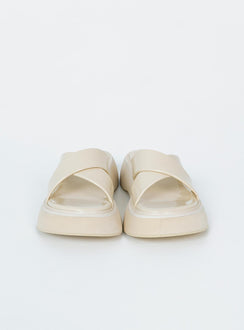 Flats Faux leather material  Cross strap upper  Platform base 