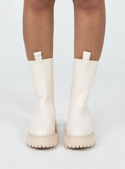 Boots Faux leather material Rounded toe Platform base Ankle pull tab Slip on style