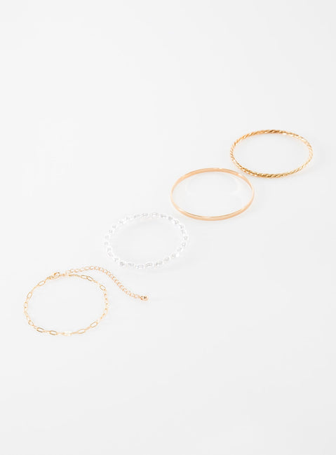 Gold-toned bracelet pack Four separate bracelets, chain and bangle style, pearl detail, lightweight 
