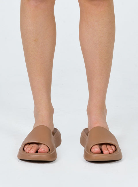 Brown slides Rubber design  Single wide upper  Platform base  Lightweight 