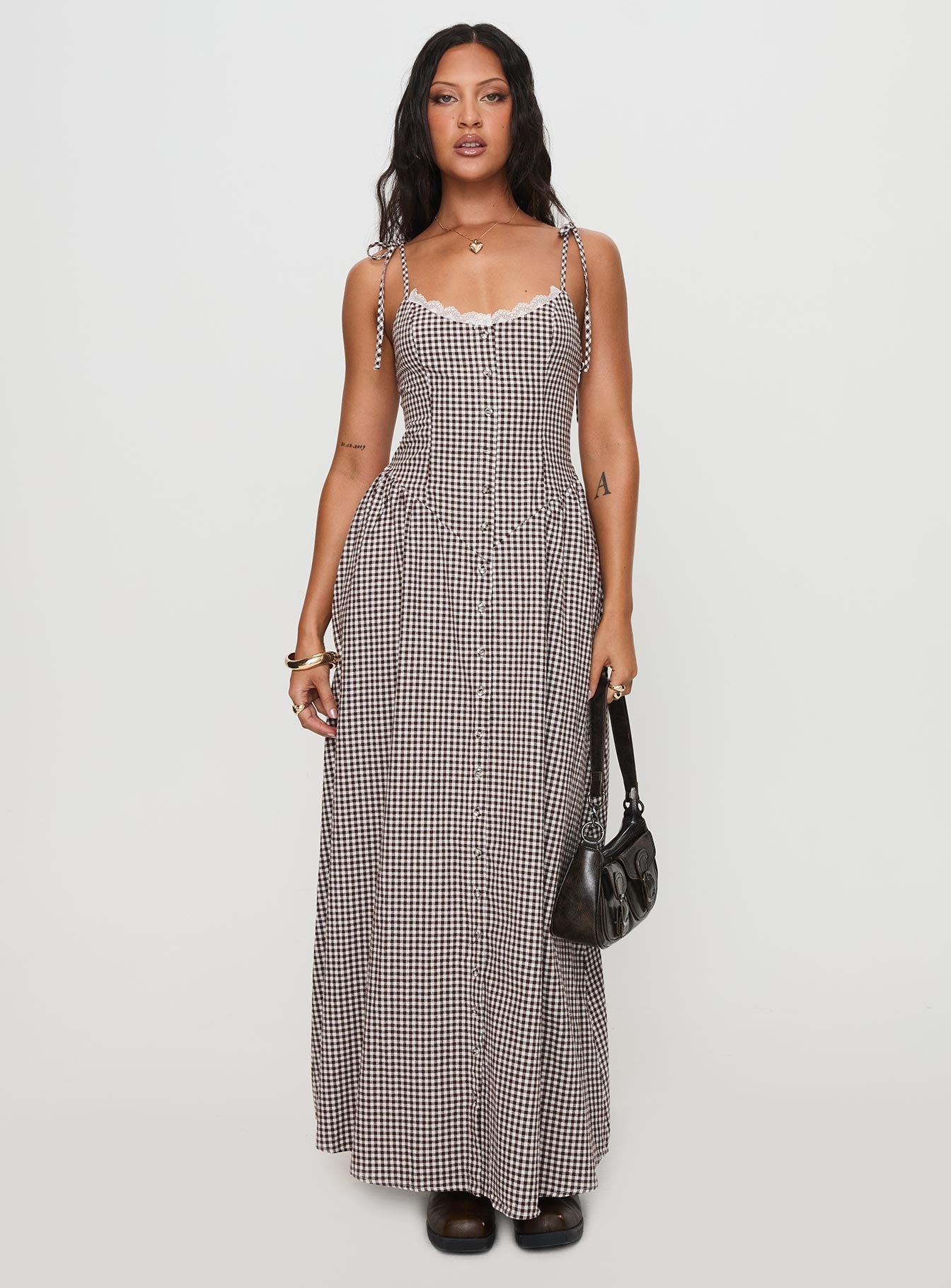 side view of model wearing Princess Polly Dalanie Tie Strap Maxi Dress Brown Gingham Scoop Neck 