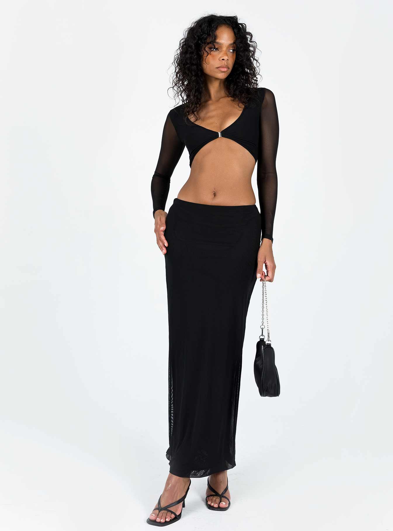 Matching set Kristen is wearing a size US 2 / AU 6 Mesh material Long sleeve crop top V-neckline Clasp fastening at front Maxi skirt Elasticated waistband  Good stretch Lined body