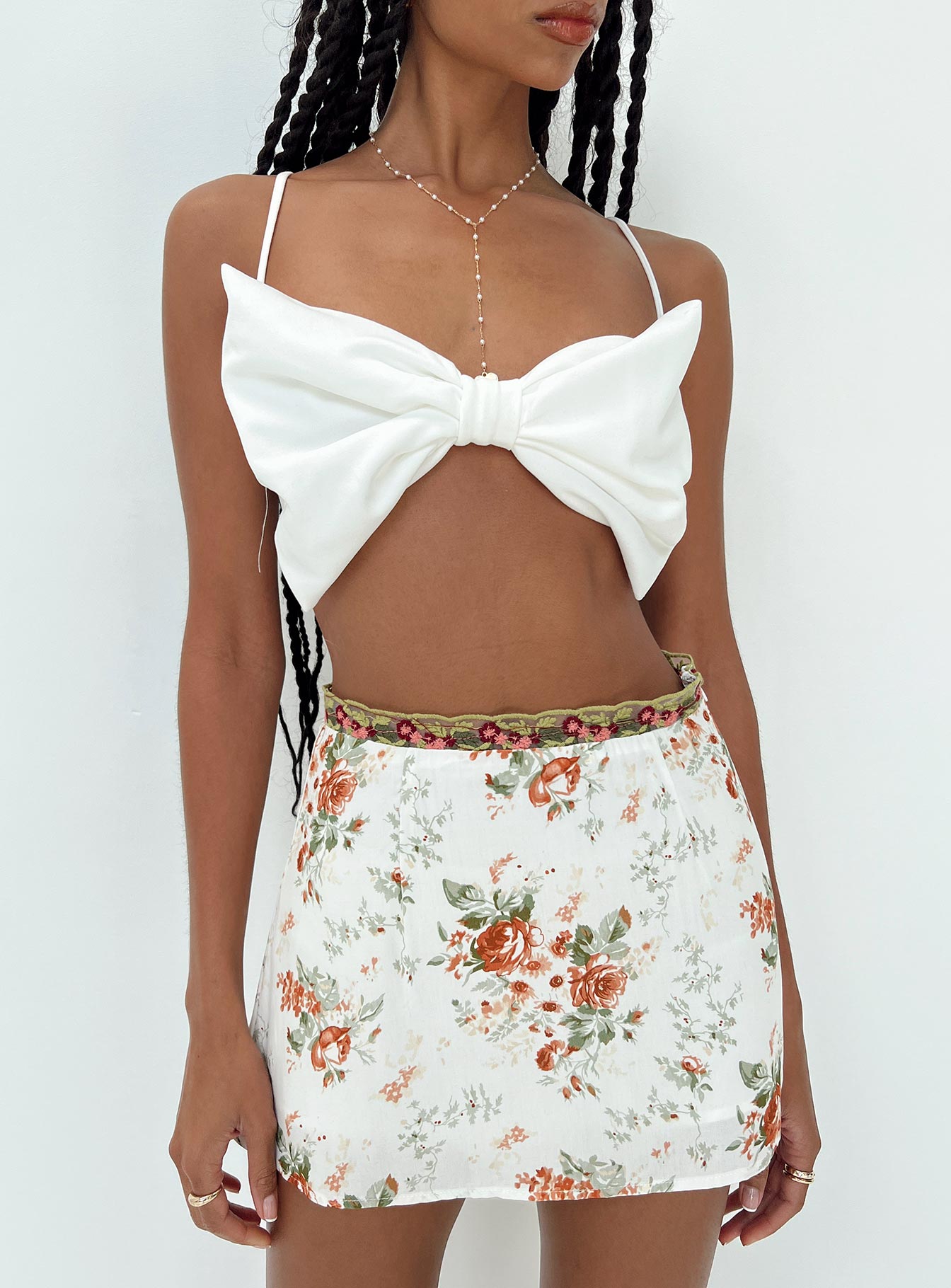 Front view of model wearing  front Princess Polly Sleeveless Square Neck  Goldwyn Bow Top White