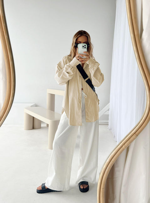 Front view of model wearing  front Princess Polly Short Sleeves Crew Neck  Baywood Shirt Beige