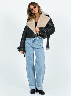 Cropped jacket Faux leather material Oversized collar Removable belts at waist and cuff Buckle fastening 