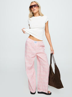 side view of model wearing Princess Polly Beach House Pants Pink Stripe High Waisted Pants 