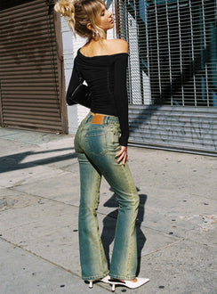 back view of model wearing Princess Polly Sandman Flare Jeans Antique Wash Mid Rise 