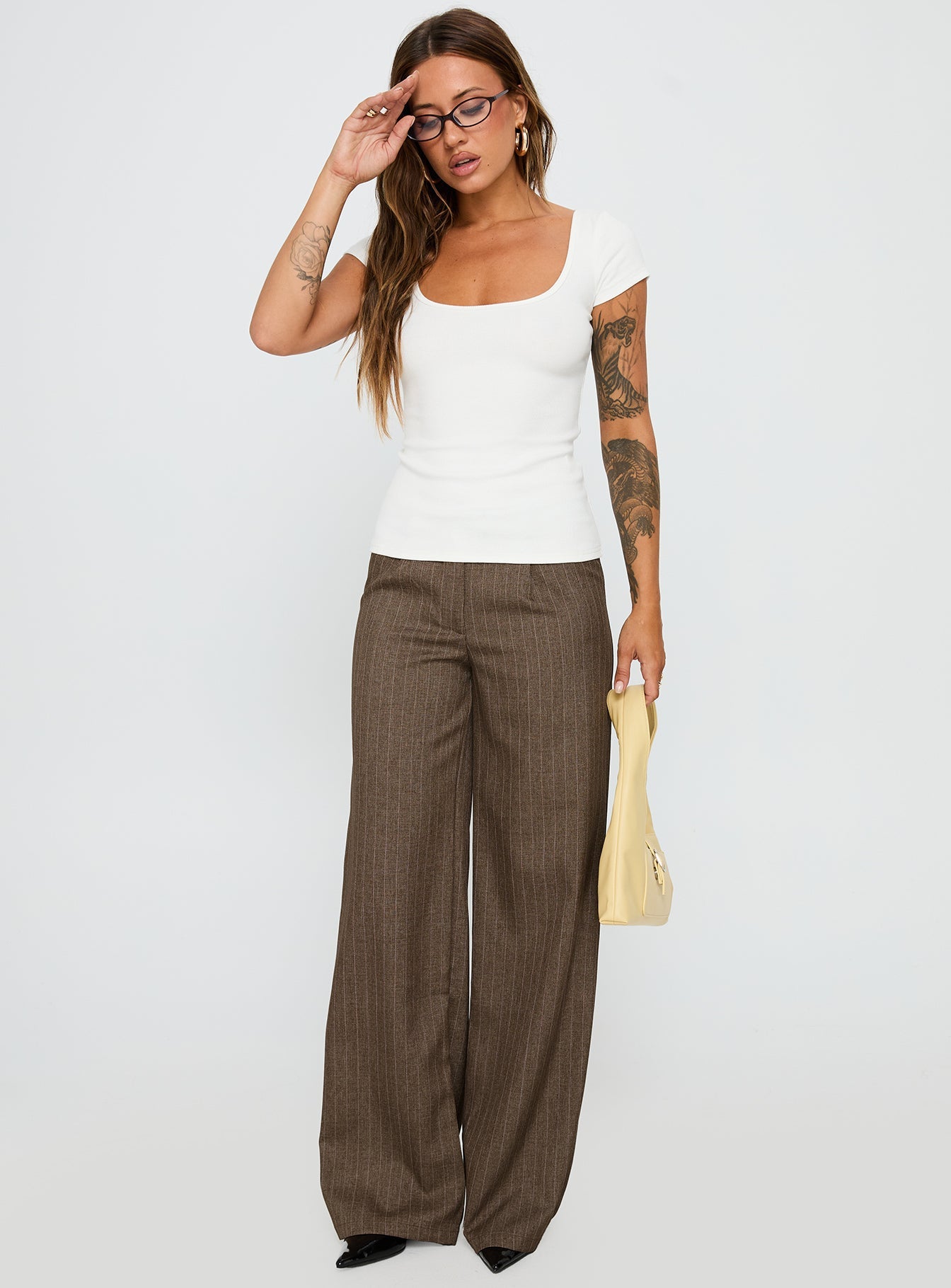 front view of model wearing Princess Polly Broadcast Pants Beige Pinstripe Low Rise Pants 