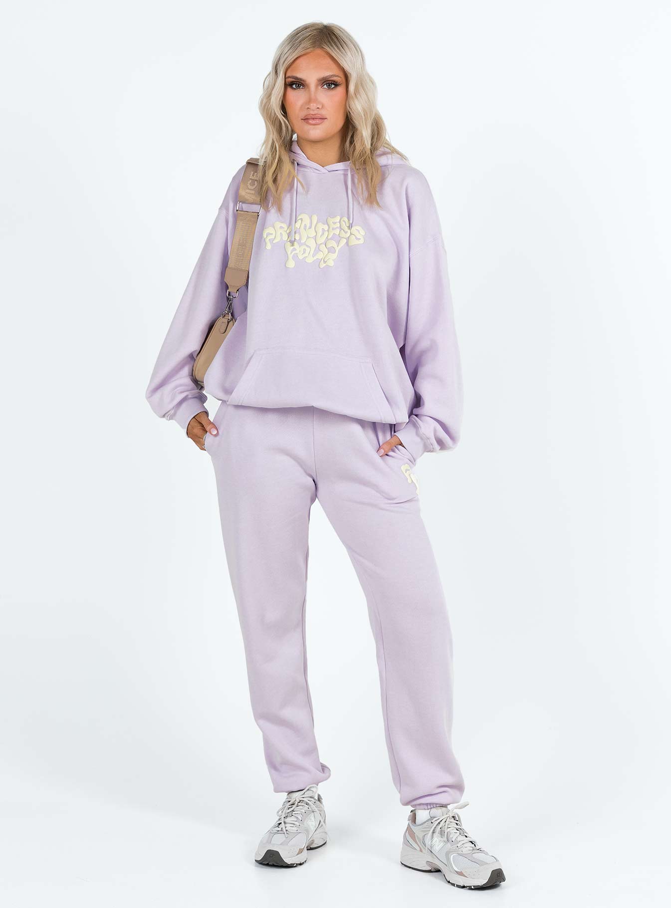 front view of model wearing Princess Polly Princess Polly Hooded Sweatshirt Squiggle Text Dusty Mauve / Eggshell regular 