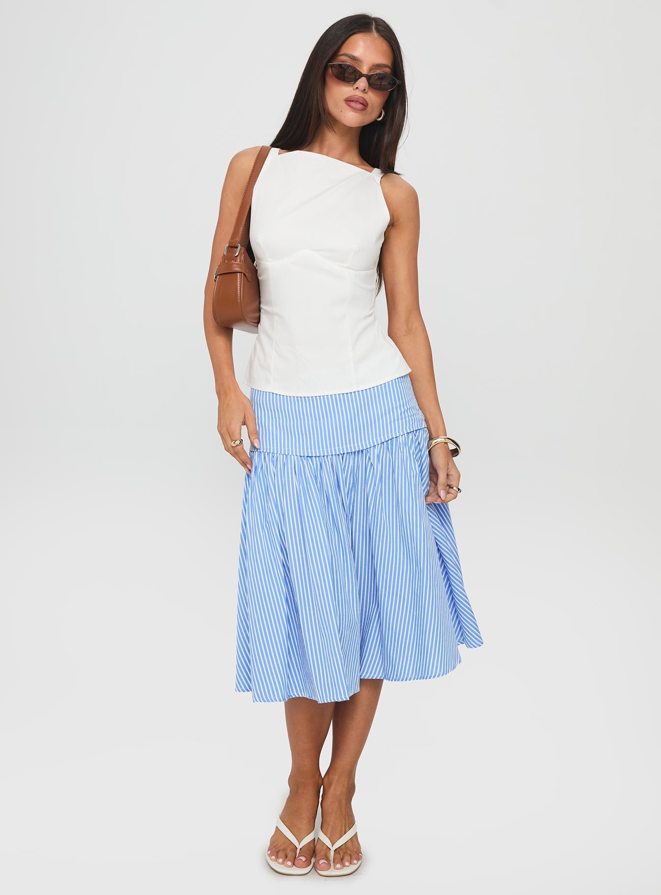   side view of model wearing Princess Polly Raelan Tiered Midi Skirt Blue Stripe Midi Skirts 