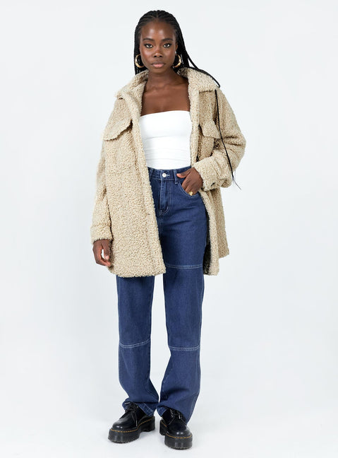 Teddy coat Faux fur material  Classic collar  Button front fastening  Twin chest pockets