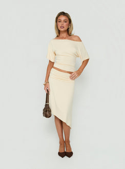 Discover the Sezzia Ruched Asymmetrical Midi Skirt Beige womens-skirts crafted with fitted design and length side view of model wearing Princess Polly