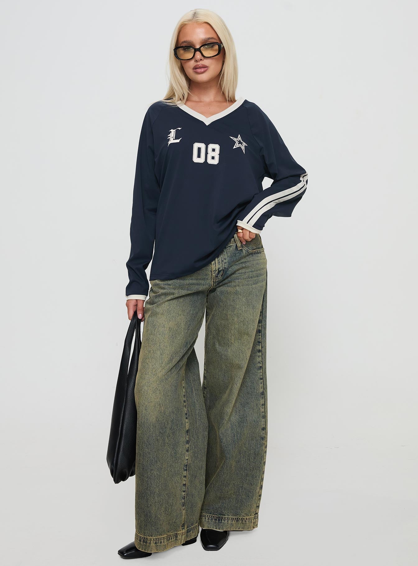 front view of model wearing Princess Polly Spectate Top Long Sleeve Navy Full Sleeves V-Neck 