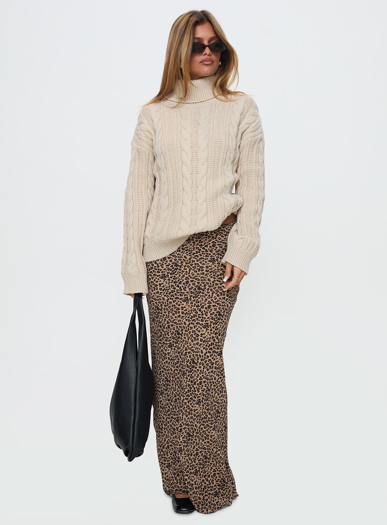 side view of model wearing Princess Polly Bryden Turtleneck Cable Knit Sweater Beige Long 