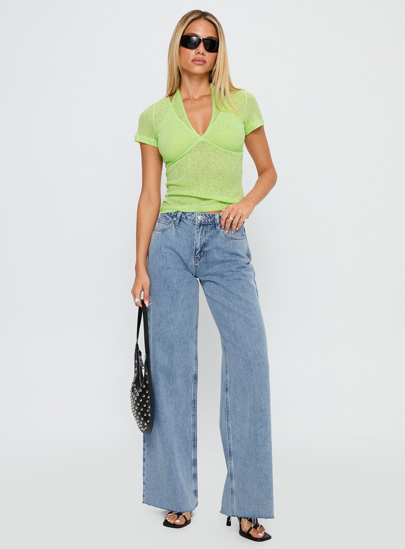 side view of model wearing Princess Polly Darla Low Rise Straight Jean Vintage Blue Wash Low Rise Jeans 