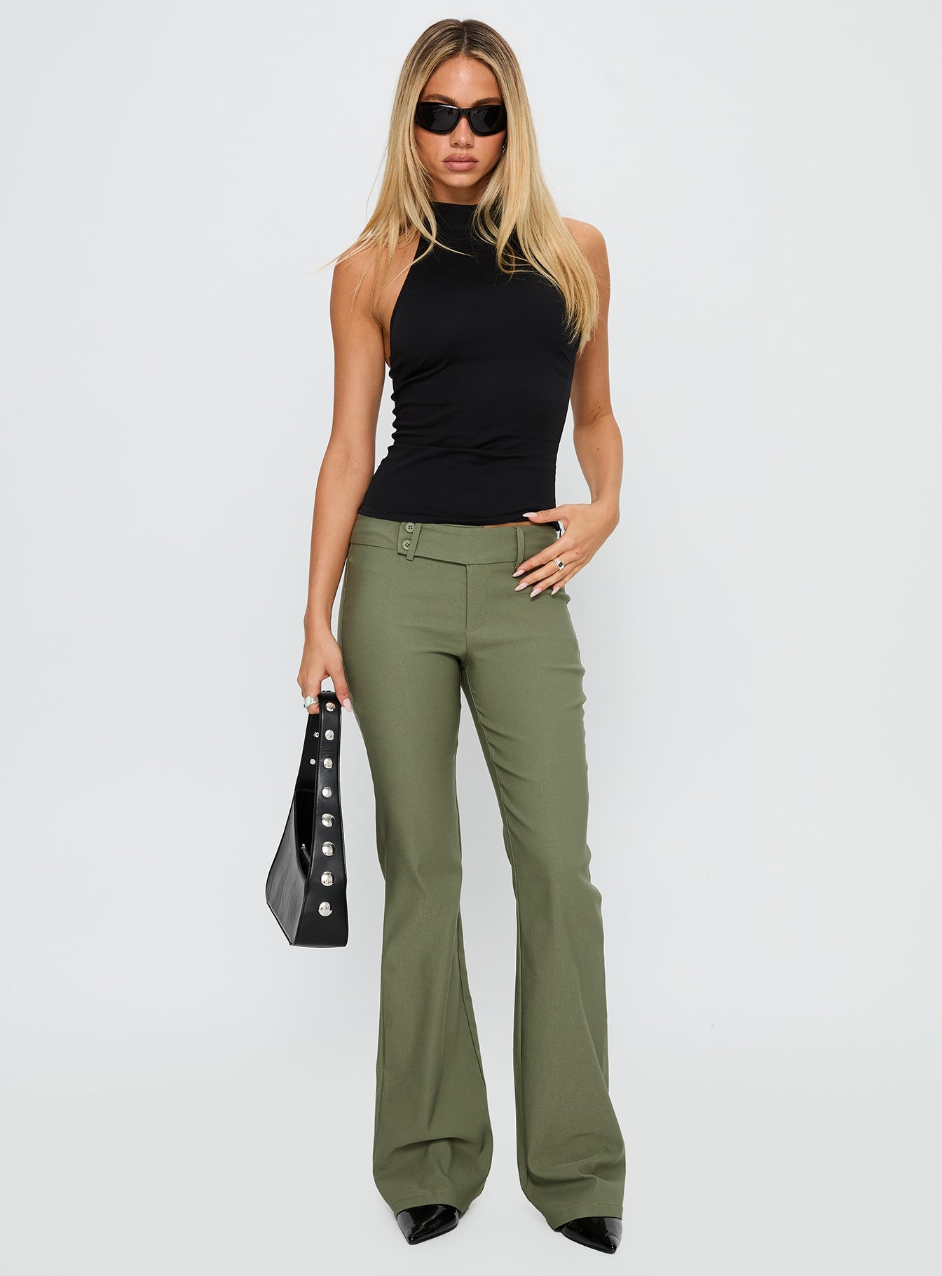front view of model wearing Princess Polly Kinkirk Flared Pants Olive Green Low Rise Pants 