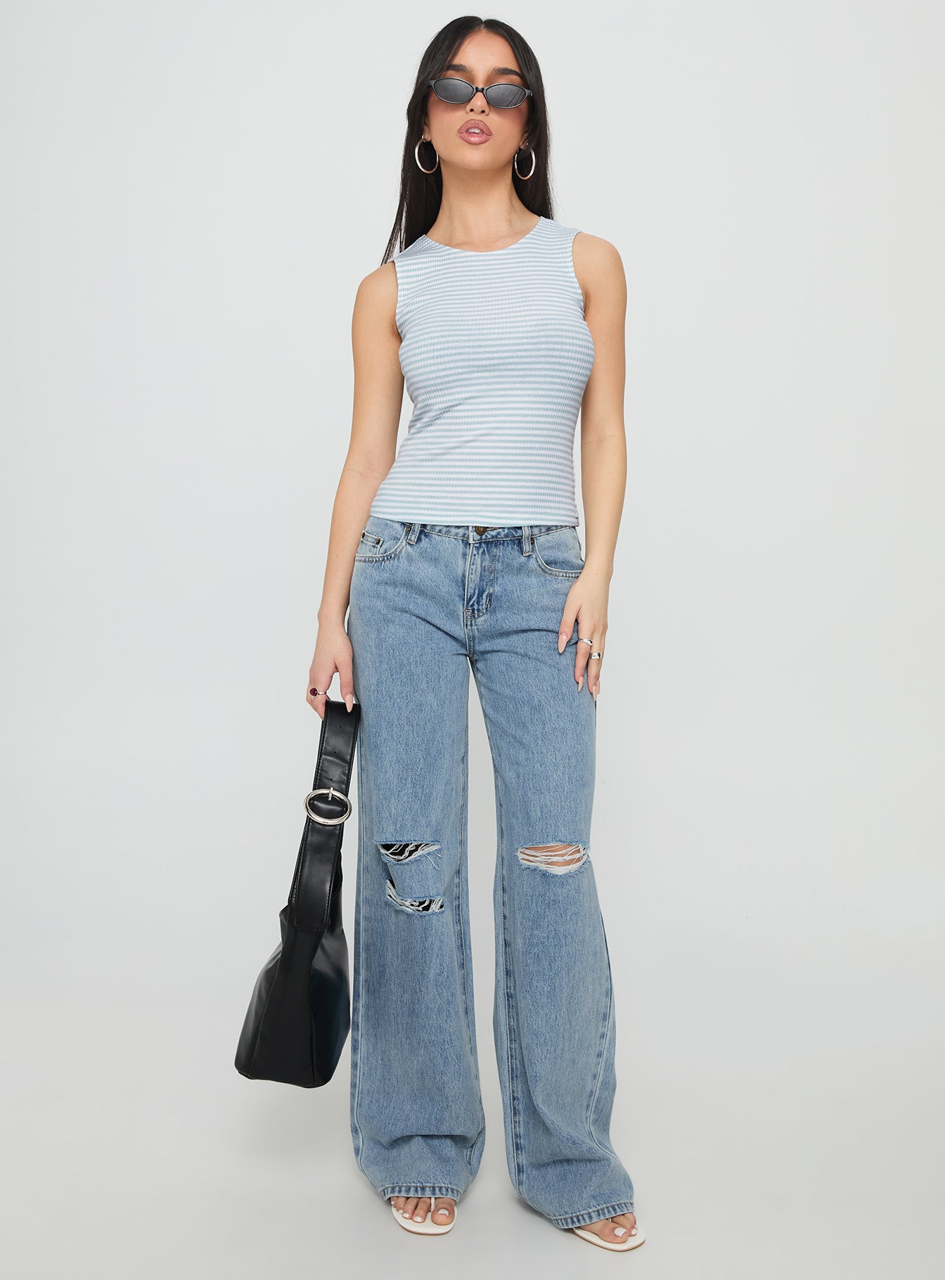 front view of model wearing Princess Polly Kadison Low Rise Straight Leg Jeans Mid Wash Blue Low Rise Jeans 