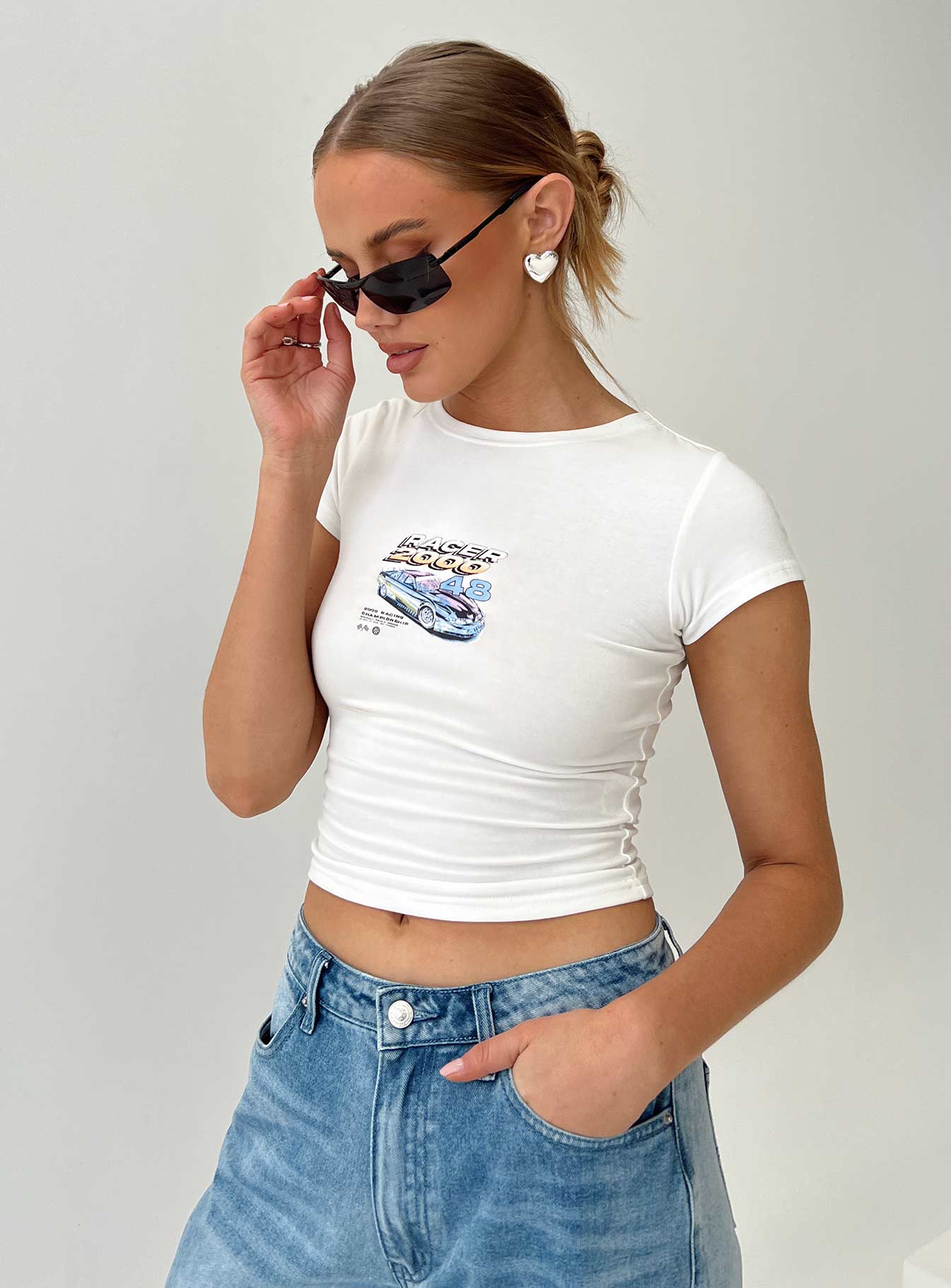 Front view of model wearing  front Princess Polly Short Sleeves Crew Neck  Getaway Baby Tee White