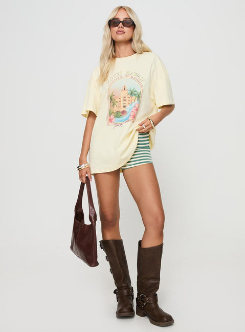 front view of model wearing Princess Polly Hotel Hawaii Oversized Tee Yellow Half Sleeves Crew Neck 