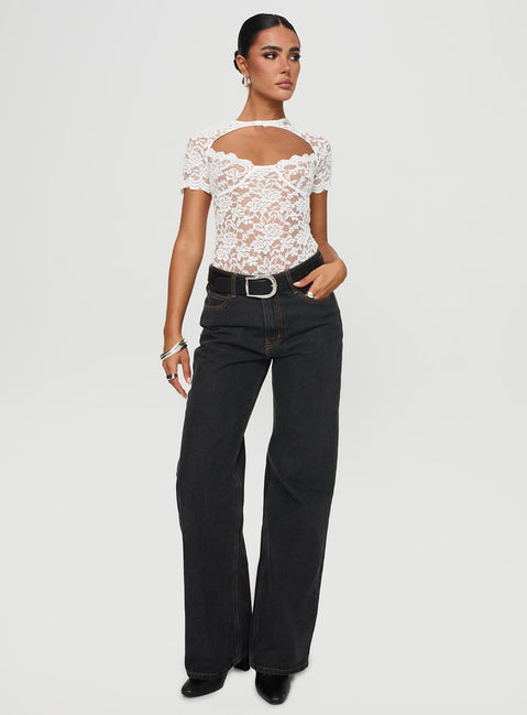 side view of model wearing Princess Polly Giallo Bodysuit White Short Sleeve 