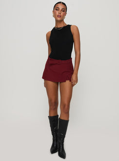 front view of model wearing Princess Polly Centre Stage Cut Out Bodysuit Black Sleeveless 